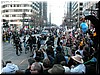 A dozen police officers on bike and motorbikes make way for the march to begin (behind them)